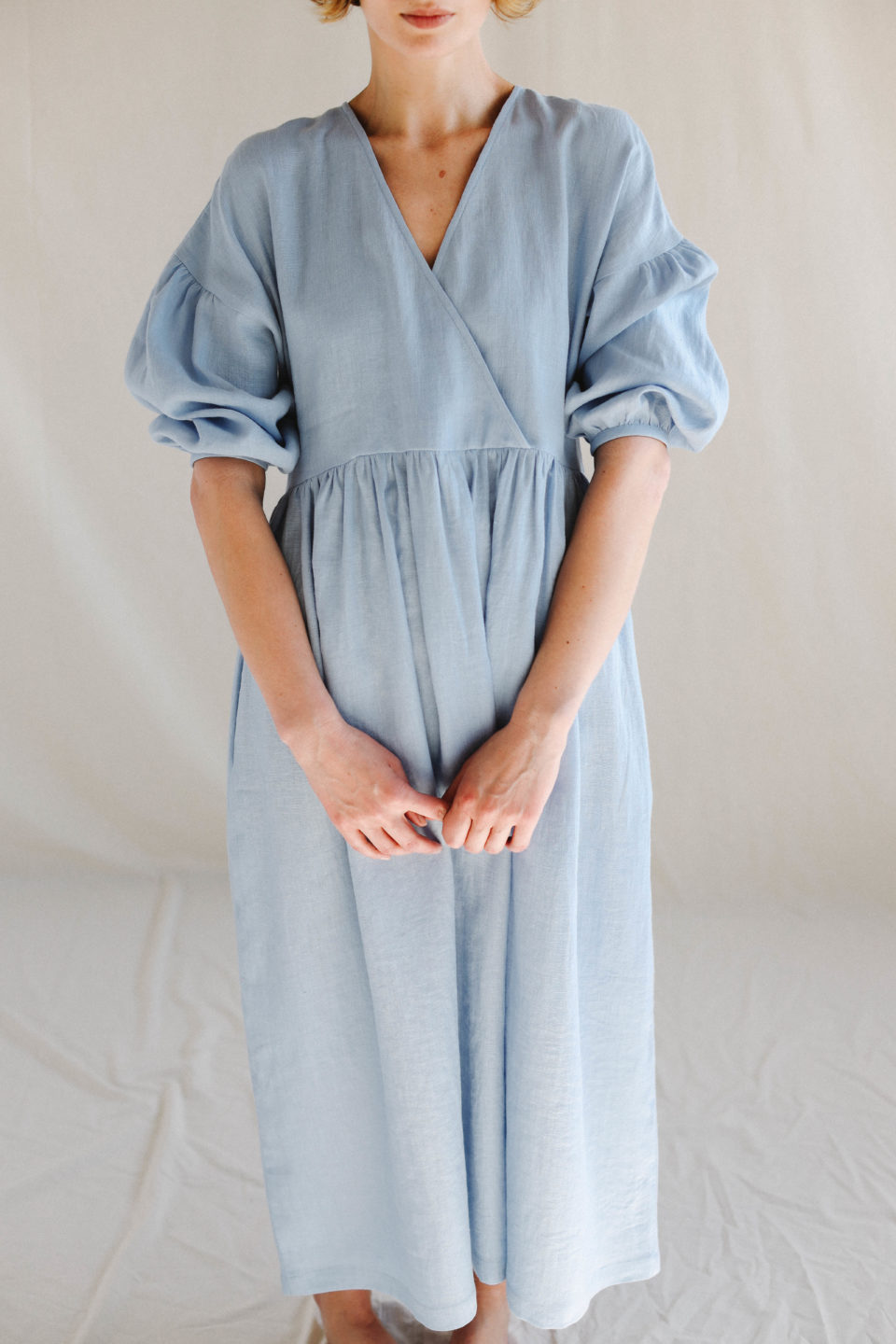 puff sleeve v neck dress Solanna Mini SIZING Slim fit Maxi length 52 length based on size S Model is 510 and is wearing a size S Puff Sleeve V-Neck Tiered Solid