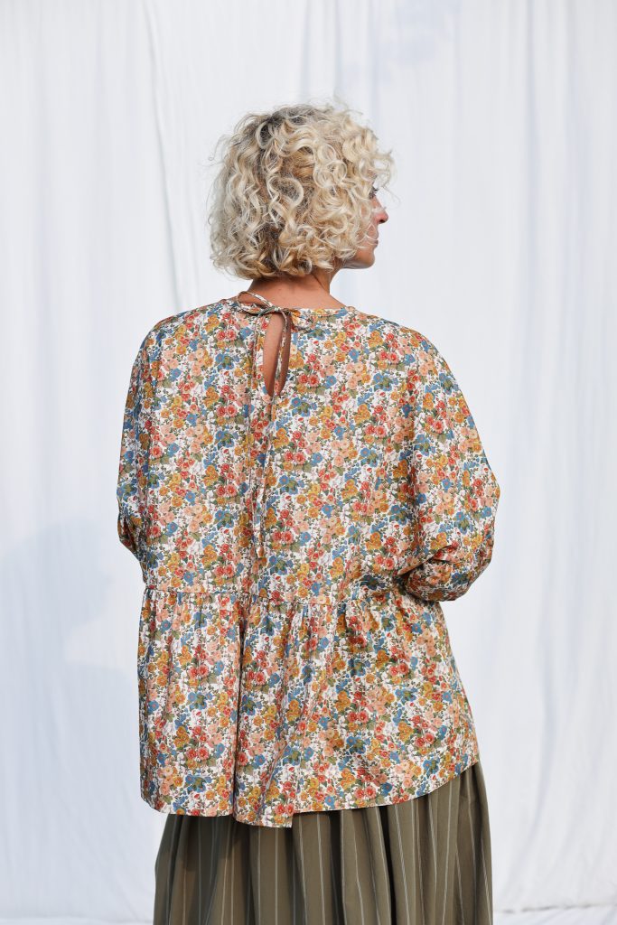 Dropped Shoulders Floral Peplum Blouse EVE