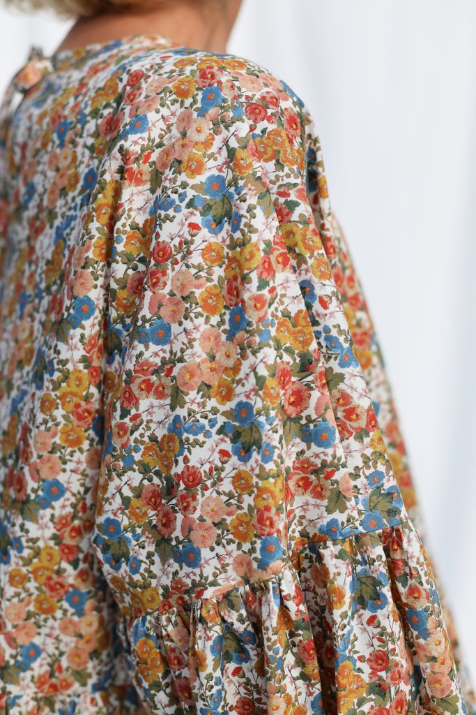 Dropped Shoulders Floral Peplum Blouse EVE